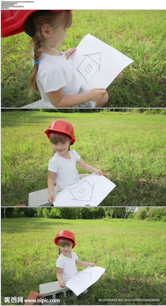 小女孩草地拿着画纸
