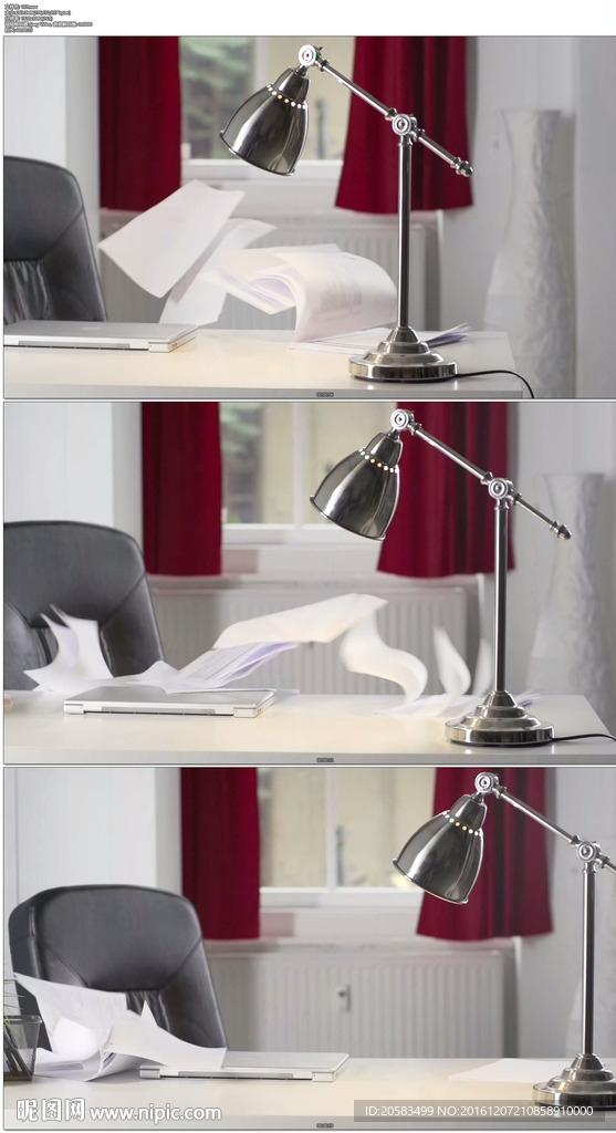 台灯办公桌上纸张飞舞