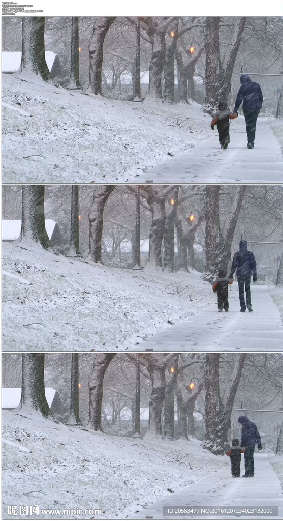 母亲牵着孩子在雪中行走