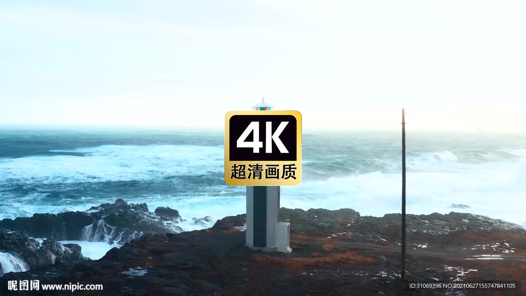 航拍海浪拍打礁石海边灯塔