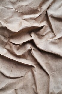 皱褶的米色纸张纹理