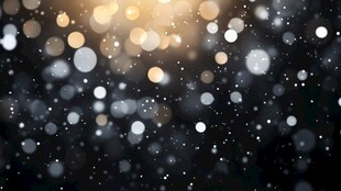 金色粒子在黑色背景上浮动