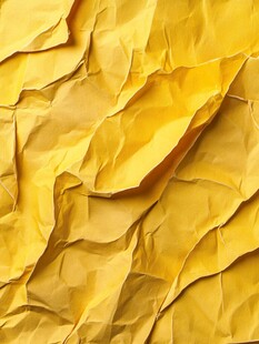 黄色褶皱纸张纹理背景