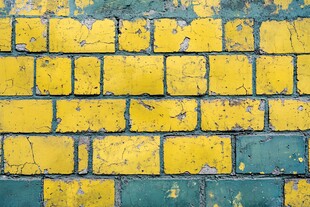 斑驳黄蓝相间砖墙纹理