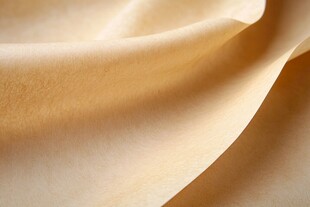 米黄色柔软织物纹理特写