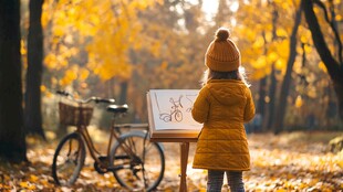 秋日林间小女孩专注作画