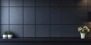 深色墙面旁的清新绿植花卉