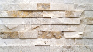 米色石砌墙面纹理特写