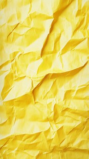 黄色褶皱纸张纹理特写