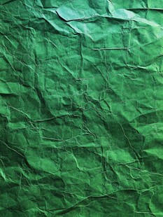 绿色褶皱纸张纹理背景