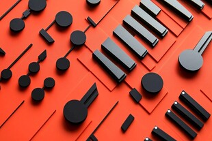 黑色零件在橙背景上的排列