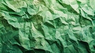 绿色褶皱纸张纹理特写
