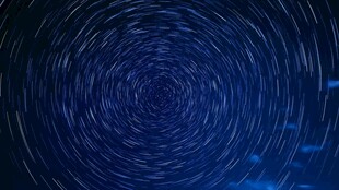 梦幻蓝色星轨漩涡背景