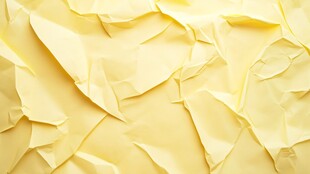 黄色褶皱纸张纹理背景