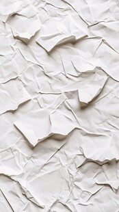 白色褶皱纸张纹理特写