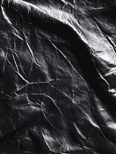 黑色褶皱皮革纹理背景