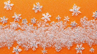 橙色背景上的精致雪花装饰