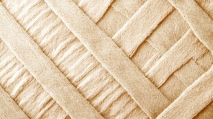 米黄色编织纹理布料特写