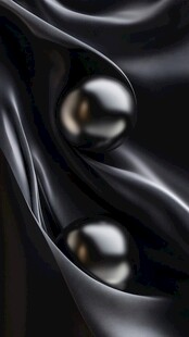 黑绸上的两颗圆润珍珠