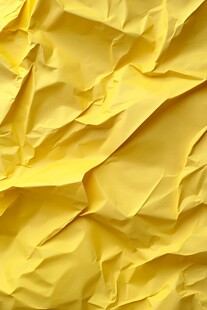 黄色褶皱纸张纹理背景