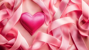 粉色丝带环绕的心形图案