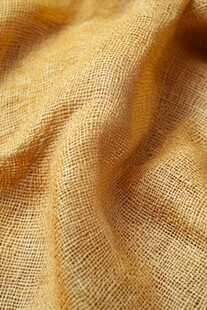 暖黄色麻质布料纹理特写