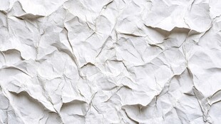白色褶皱纸张纹理特写