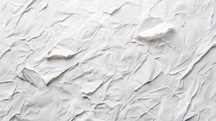 白色褶皱纸张纹理特写