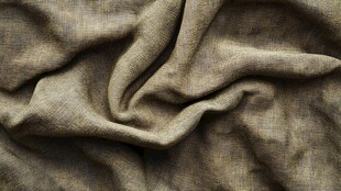 浅棕色褶皱亚麻布料纹理