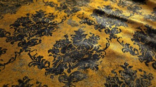 金色锦缎花纹布料特写