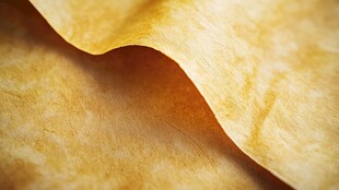 卷曲的金黄纸张纹理