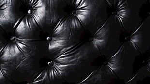 黑色皮革沙发纹理特写