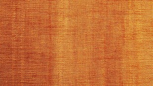 橙红色织物纹理背景图