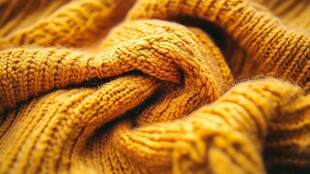 温暖黄色针织毛衣纹理