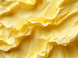 黄色褶皱纸张纹理特写