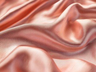柔滑粉橘色丝绸纹理特写