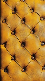 复古黄皮革沙发纹理特写