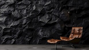 黑色岩墙旁的复古皮革椅