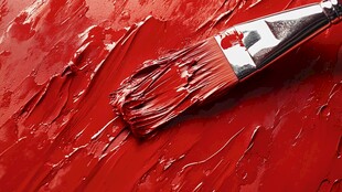 红色画笔蘸满鲜艳颜料