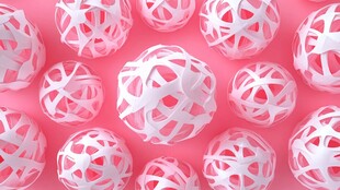 粉色背景上的白色纸艺球