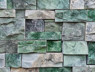 绿色石砌墙面纹理特写