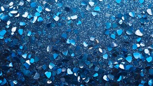 蓝色闪耀心形亮片背景