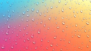 彩虹背景上的晶莹水滴