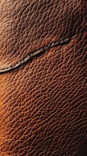 棕色皮革纹理与缝线细节