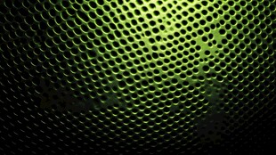 绿色穿孔金属质感背景