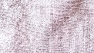浅粉色麻布纹理特写