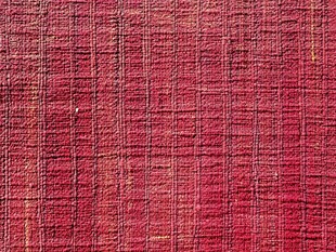 玫红色织物纹理背景图