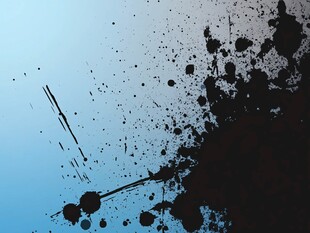 蓝色背景上的黑色墨点飞溅