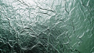 绿色褶皱纹理背景图