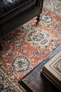 复古花纹地毯搭配黑色皮椅